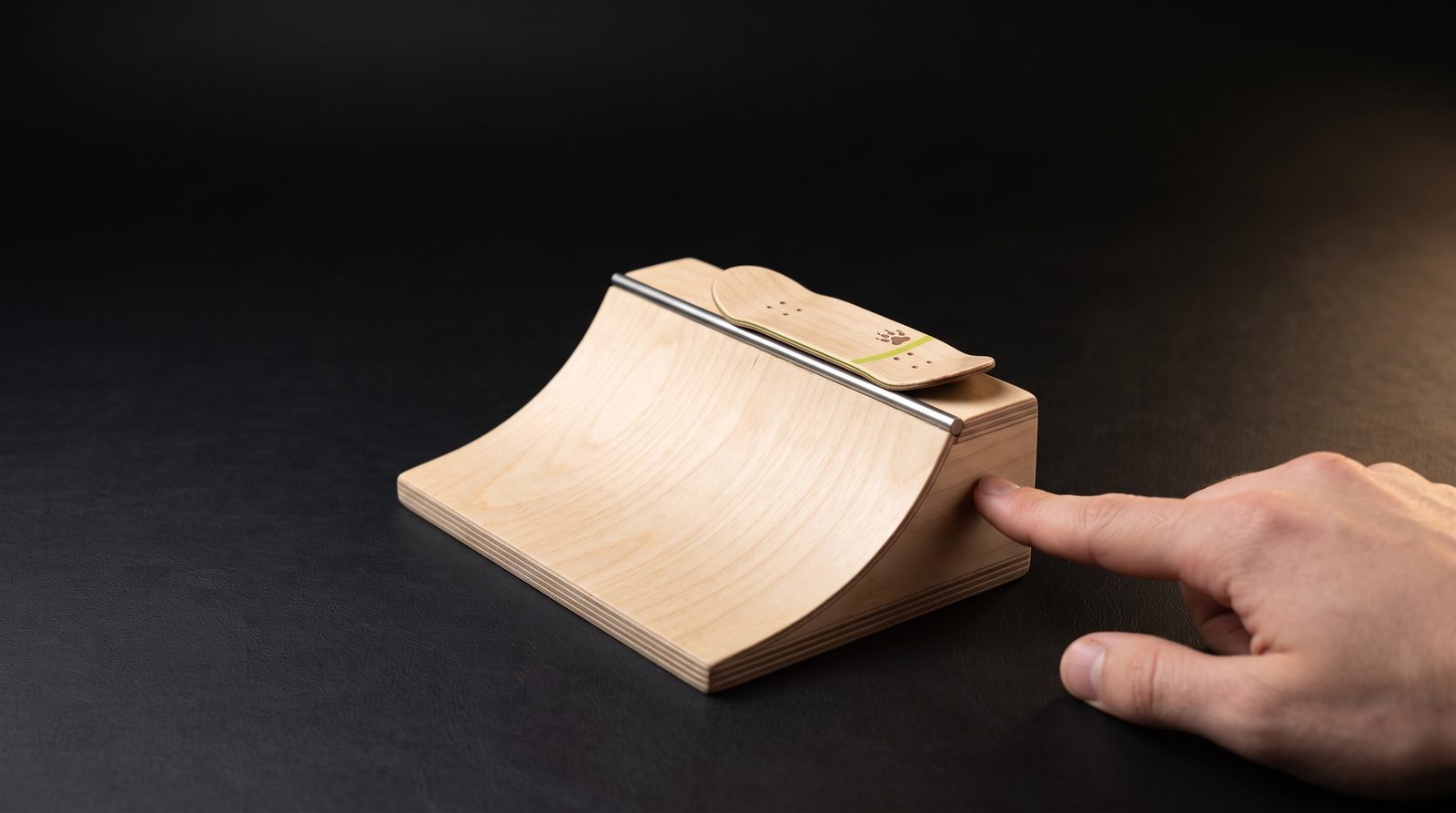 Wooden fingerboard ramps, rails and ledges arranged as a park